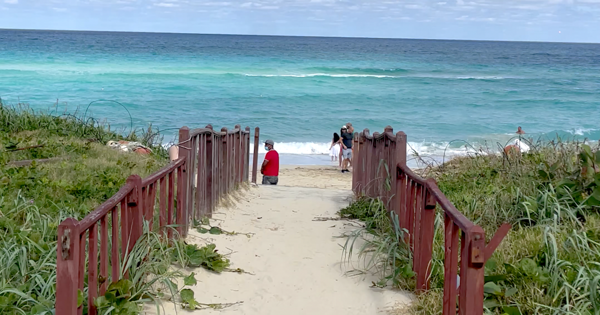 A sandy walkway leading to the sea at Santa Maria del Mar