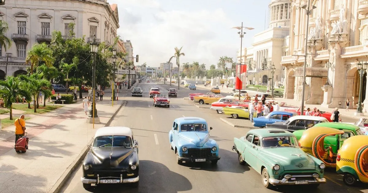 Busy street in Parque Central lined with classic cars