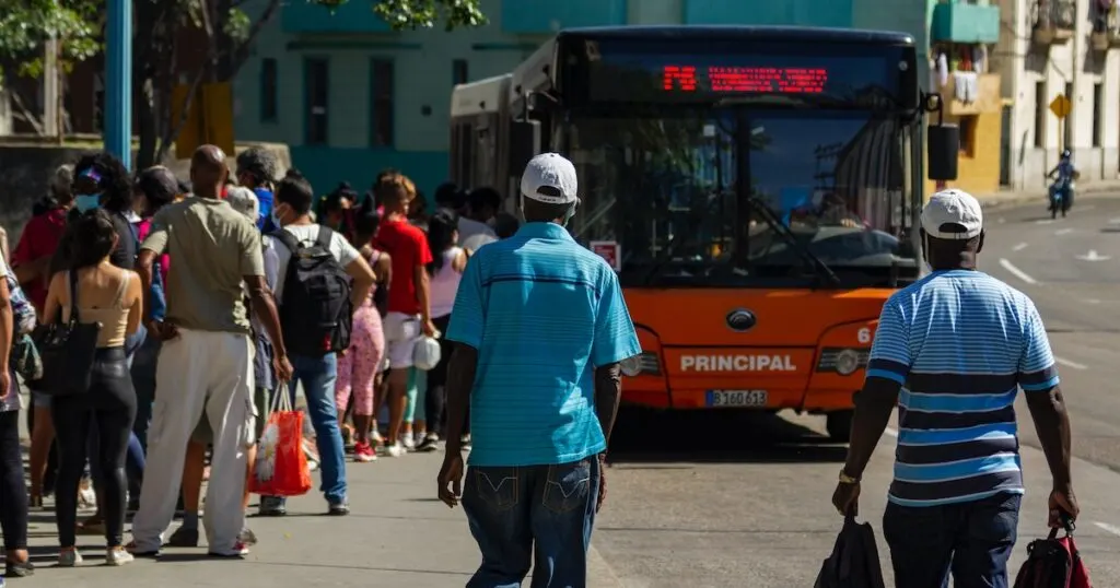 Locals queueing for a bus in Havana