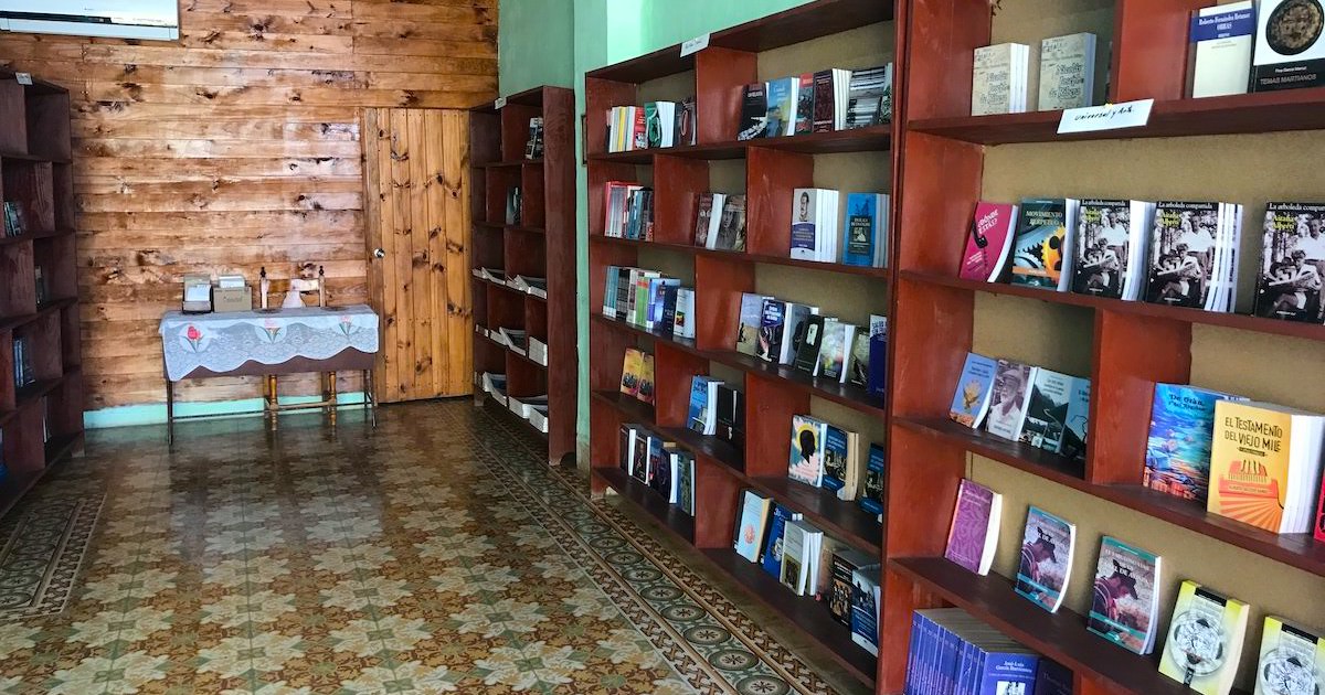 Wooden shelves filled with books in a Trinidad bookstore