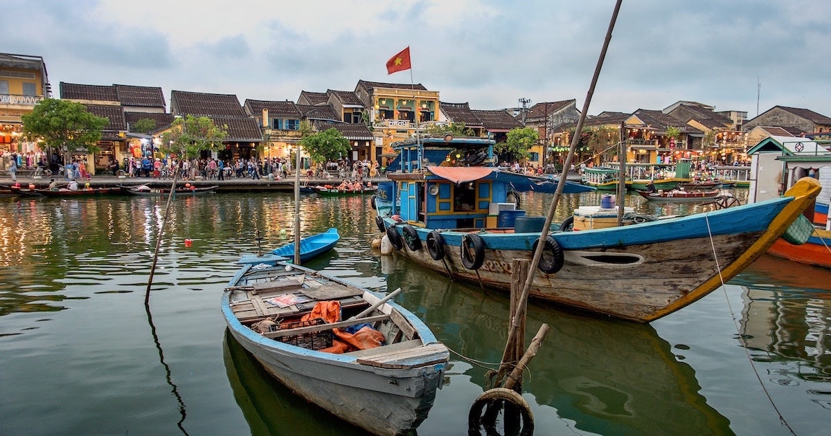 Boats on a canal surrounded by lanterns