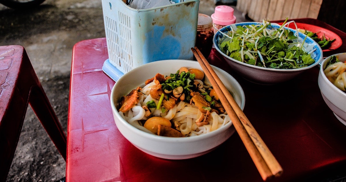 Noodles and salad with chopsticks