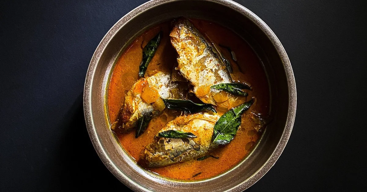 Orange-hued fish moilee curry