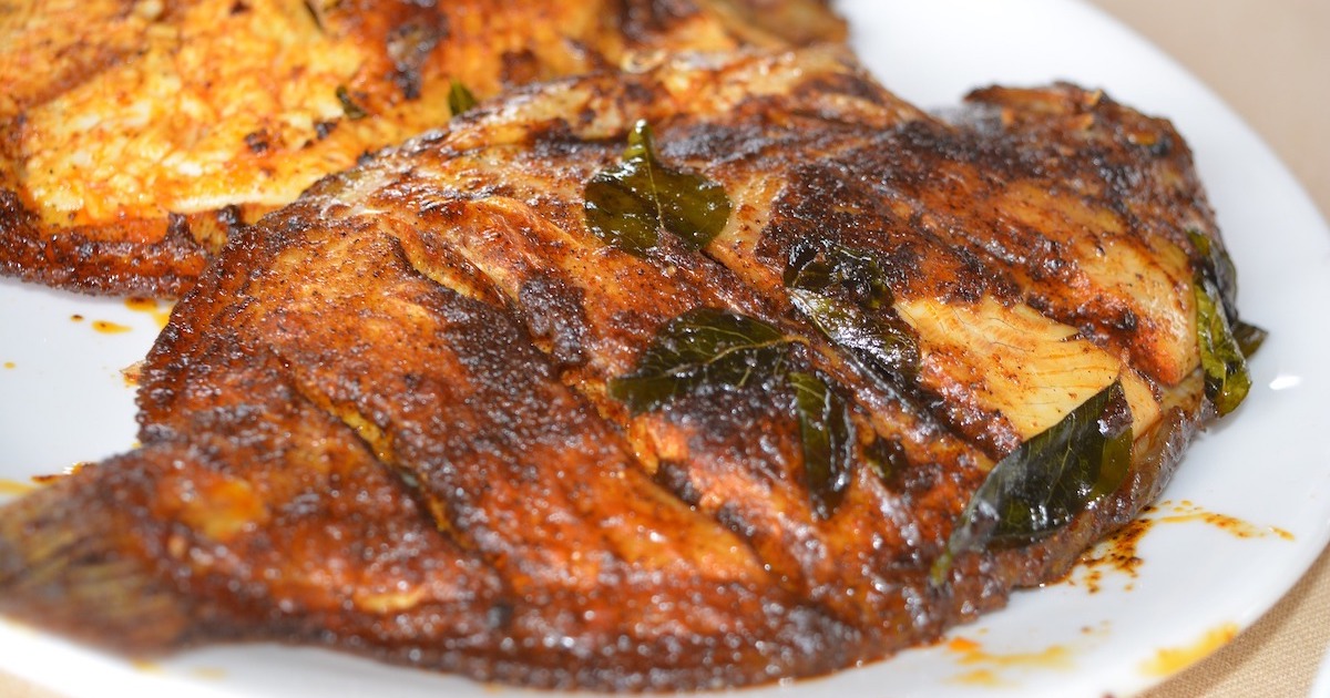 Round karimeen fish layered with spices