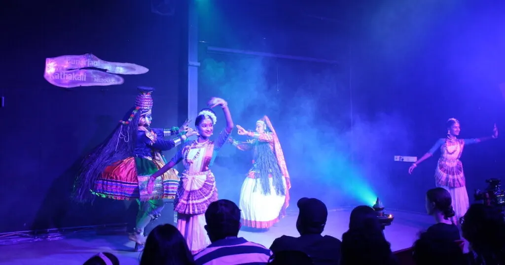 Kathakali performers in elaborate costumes and makeup.