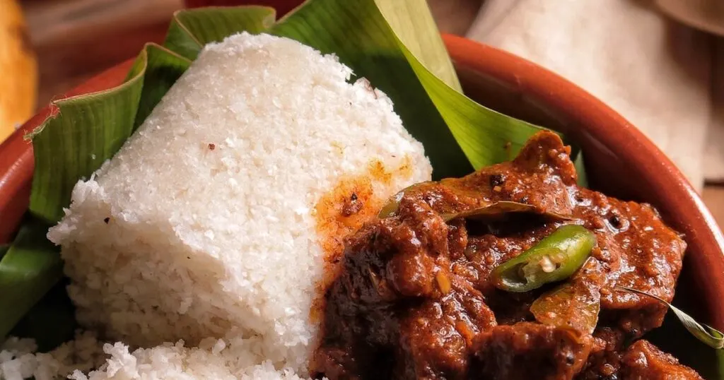 Rolled puttu balls with a vegetable curry