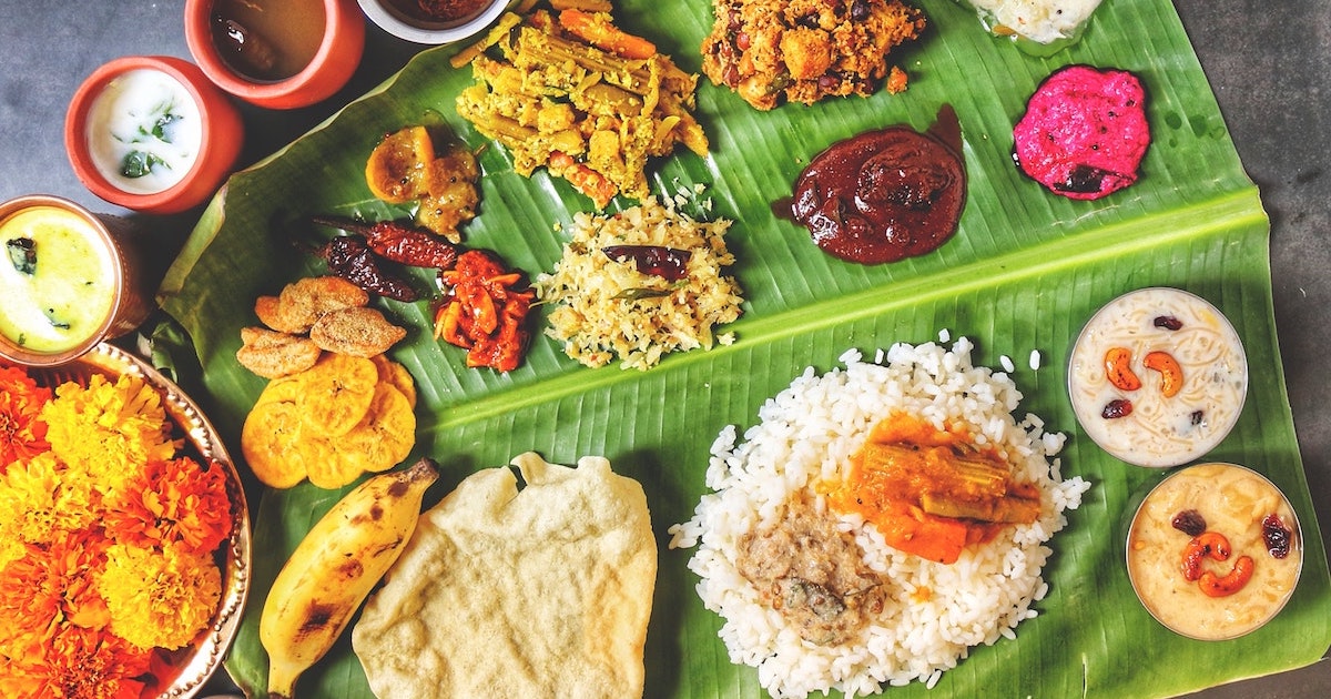 Banana leaf with rice and curry dishes