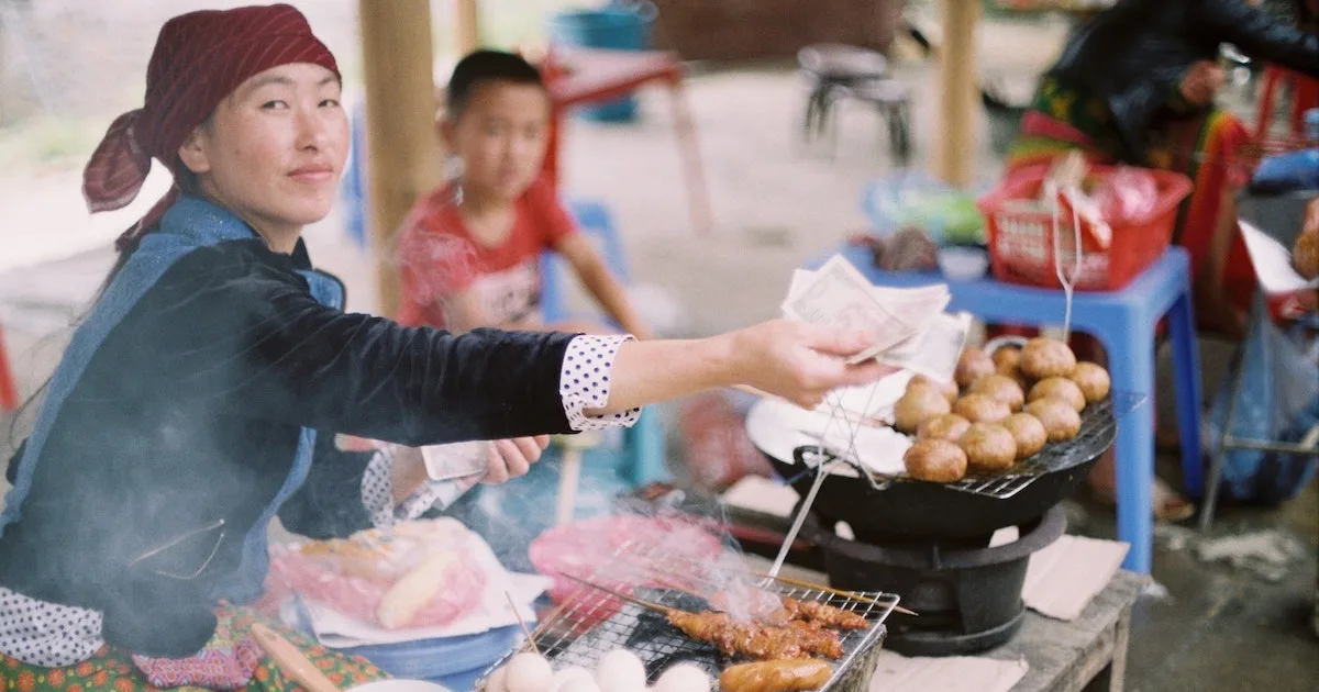 Lady operating a street food stall