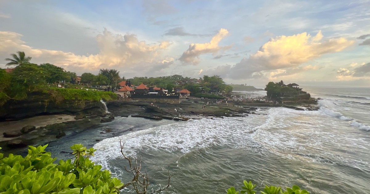 The Tanah Lot sunset view from a viewpoint along the clifftops.
