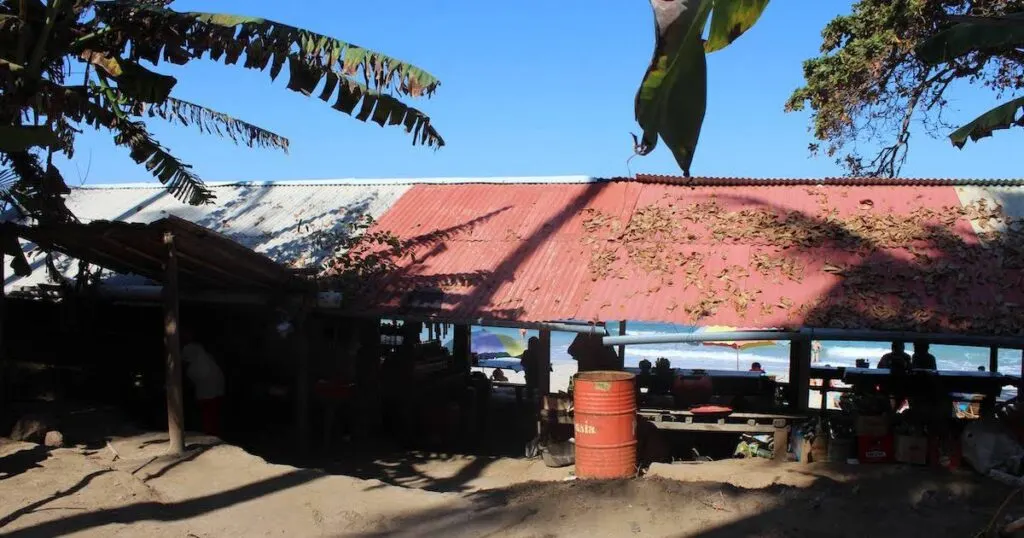 Warungs on the edge of Secret Beach are made from metal and bamboo