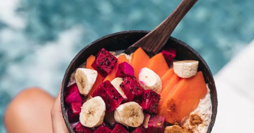 A smoothie bowl with banana, papaya and dragonfruit for something gluten free in Bali.