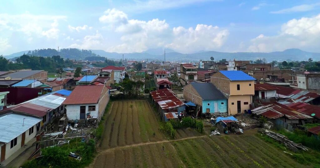 Farm fields and colourful houses in Berastagi in West Sumatra.