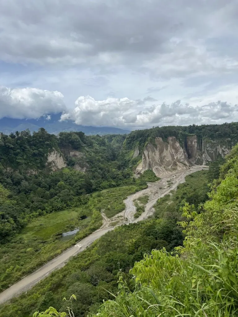 A partially-dried river weaves through Sianok Valley in Bukittinggi.