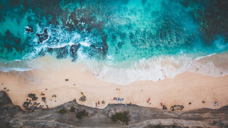 Aerial view of a sandy beach on the west coast of Nusa Penida.