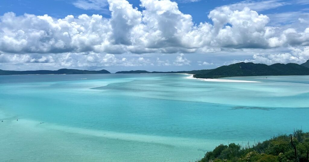 Ocean with streaks of blue from the Whitehaven Beach lookout in the Whitsunday Islands.