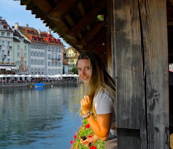Blog owner Katie Treharne looks at the camera on a bridge in Lucerne, Switzerland.