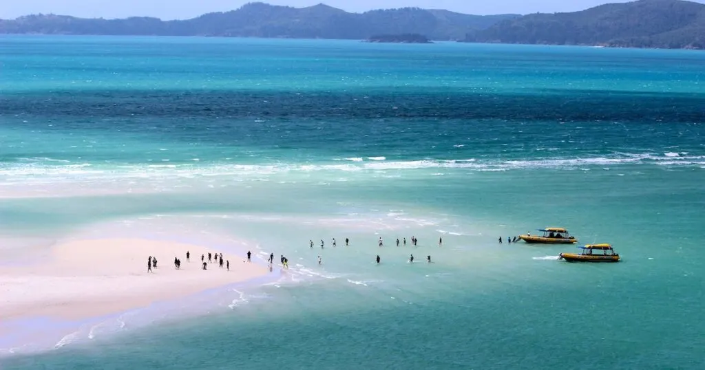 Ocean Rafting boats drop people at Whitehaven Beach, a top tour for backpacking Whitsundays.