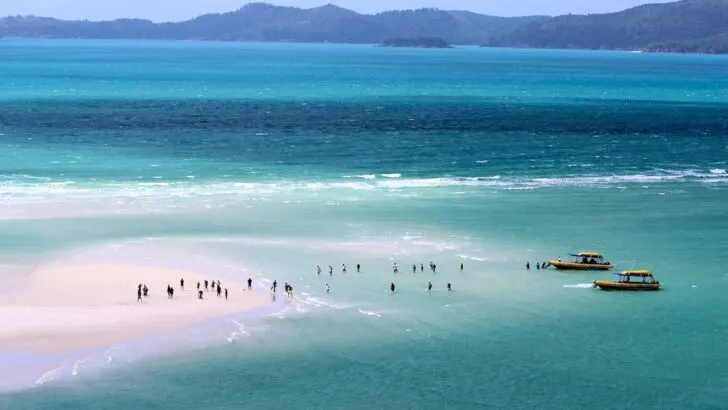 Ocean Rafting boats drop people at Whitehaven Beach, a top tour for backpacking Whitsundays.