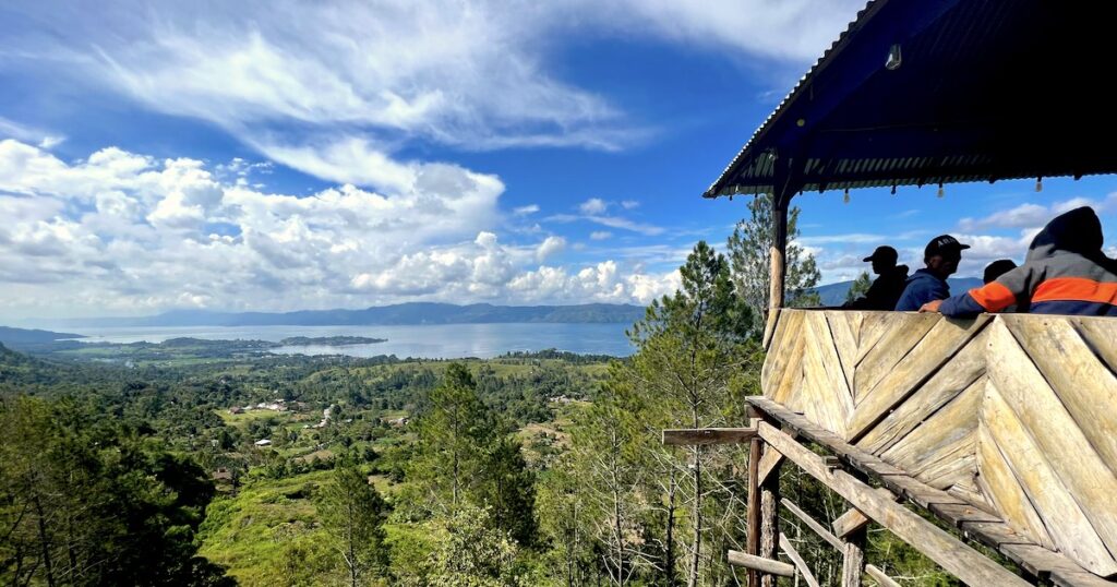 A wooden hilltop coffee shop above Tomok with views over Lake Toba.