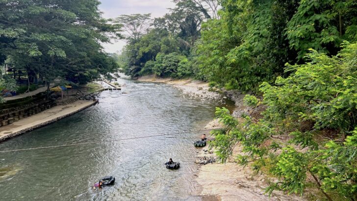 School children go river tubing on the Bohorok River, one of the best things to do in Bukit Lawang.