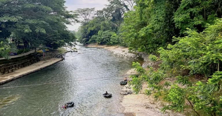 School children go river tubing on the Bohorok River, one of the best things to do in Bukit Lawang.