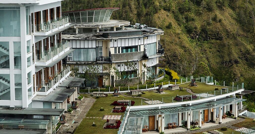 Large, modern terraces next to the glass building at Taman Simalem Resort in Lake Toba.