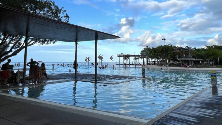 People swimming in Cairns Lagoon on the Cairns esplanade.