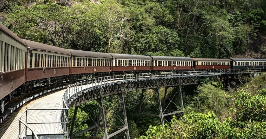 The Kuranda Scenic Railway passing over a bridge in the forest between Cairns and Karunda.