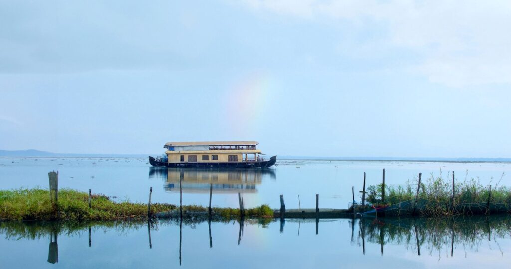 A houseboat glides along Kumarakom Lake in central Kerala.