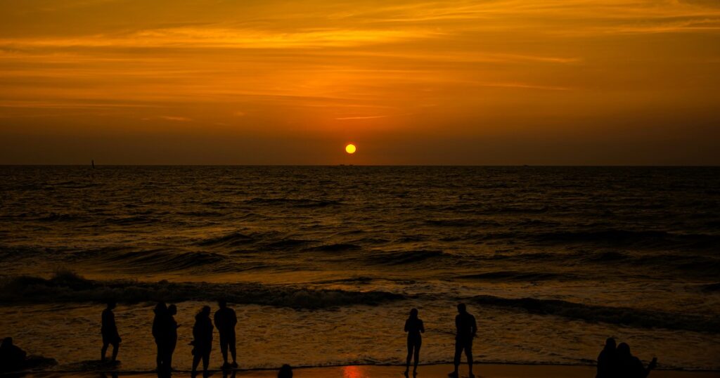 Orange sunset at Cherai Beach, one of the best things to do in Kochi.