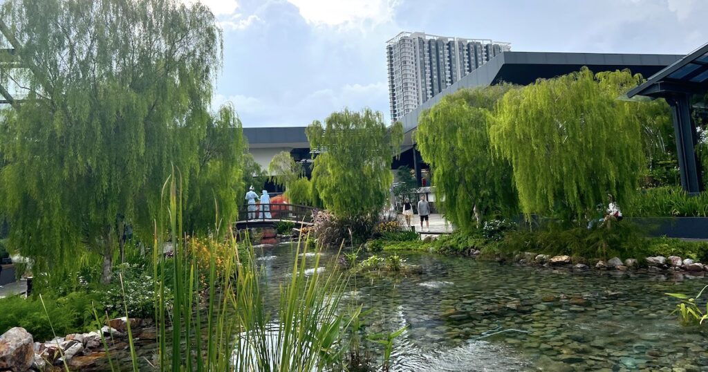 Pond surrounded by greenery at Bamboo Hills in Kuala Lumpur.