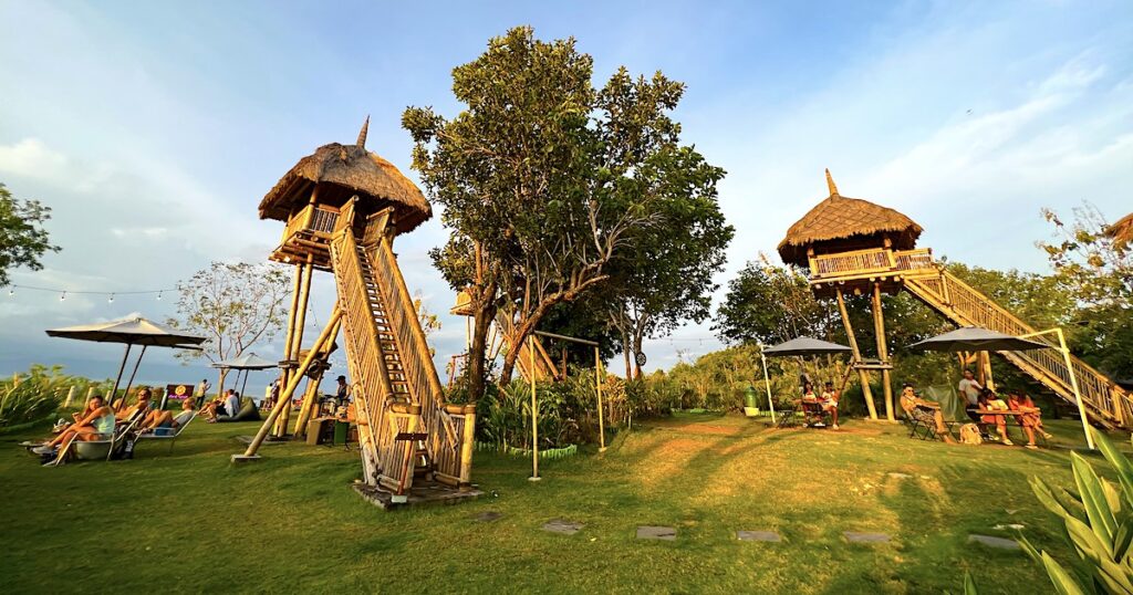 Wooden treehouses at golden hour at Amok Sunset Bar.
