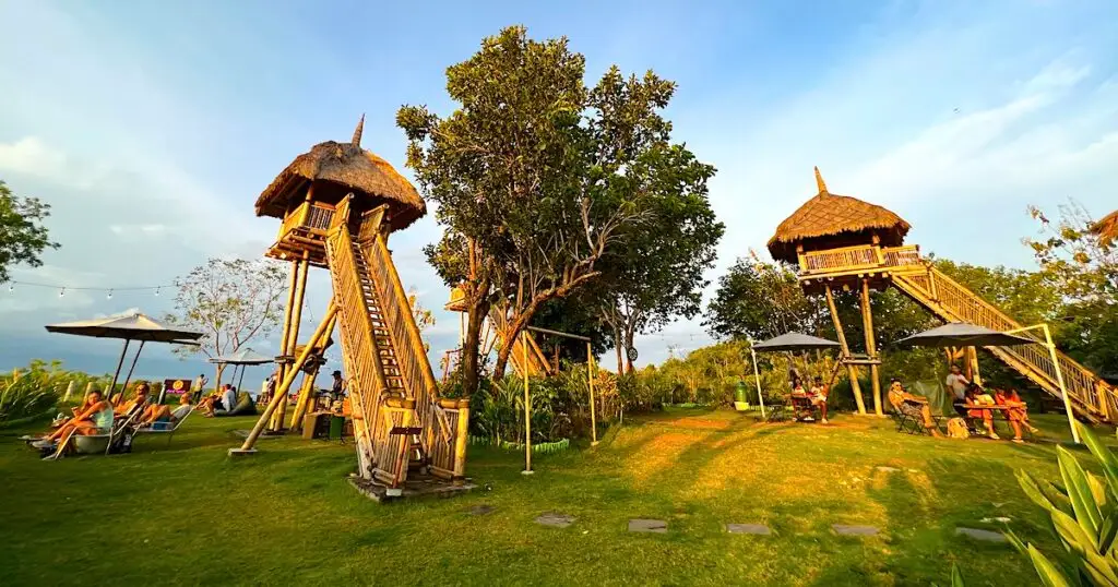 Wooden treehouses at golden hour at Amok Sunset Bar.