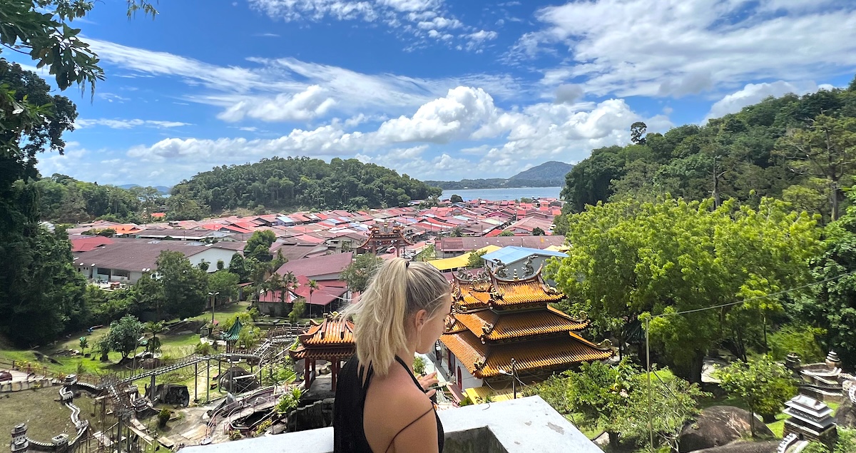 A tourist looks over the viewpoint from Fu Lin Kong Temple on Pangkor Island.